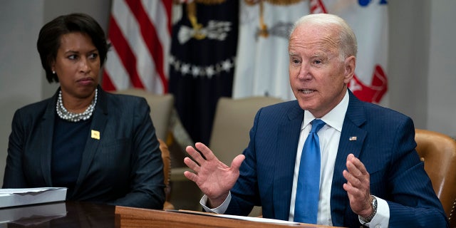 Washington Mayor Muriel Bowser listens as President Joe Biden speaks during a meeting on reducing gun violence, in the Roosevelt Room of the White House, Monday, July 12, 2021, in Washington. (AP Photo/Evan Vucci)