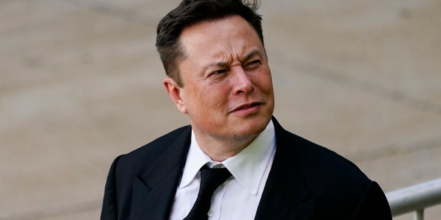 Elon Musk exits the Justice Center in Wilmington, Del., Monday, July 12, 2021. Musk took a witness stand Monday to defend his company's 2016 acquisition of a troubled company called SolarCity against a shareholder lawsuit in which it is claimed that he was to blame for a business that was fraught with conflicts of interest and never delivered the profits promised. (AP Photo/Matt Rourke)