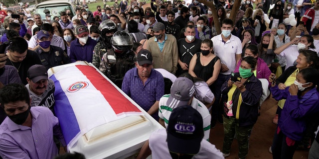 Carriers carry the coffin containing the remains of Leidy Vanessa Luna Villalba outside her home in Eugenio Garay, Paraguay on Tuesday, July 13, 2021. Luna Villalba, a nanny employed by the sister of Paraguayan first lady Silvana Lopez Moreira, was doing part of these. died in the Champlain Towers South condominium collapse in Surfside, Fla. on June 24. (AP Photo / Jorge Saenz)