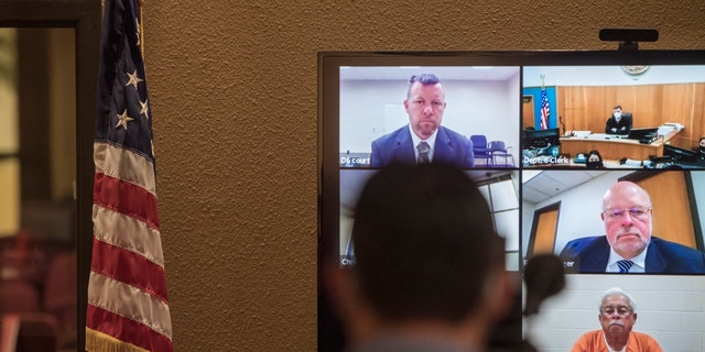 In this Thursday, April 15, 2021, file photo, defendants Paul Flores, top left, and his father, Ruben Flores, bottom right, appear via video conference during their arraignment in San Luis Obispo Superior Court in San Luis Obispo, Calif.  (AP Photo/Nic Coury, File)