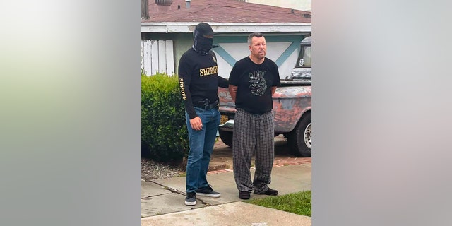 A file photo provided by the San Luis Obispo County Sheriff's Office on Tuesday, April 13, 2021 shows suspect Paul Flores in custody in the San Pedro neighborhood of Los Angeles in the murder of Christine Smart.