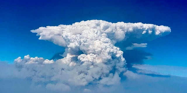 In this photo taken with a drone provided by the Bootleg Fire Incident Command, a pyrocumulus cloud, also known as a fire cloud, is seen over the Bootleg Fire in southern Oregon on Wednesday, July 14, 2021. (Bootleg Fire Incident Command via AP)