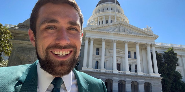 In a photo provided by Kevin Paffrath, Kevin Paffrath smiles for a selfie in front of the California State Capitol in Sacramento on Friday, July 16, 2021. The 29-year-old YouTuber is one of the Democrats running in the recall against California Gov. Gavin Newsom. Paffrath's videos typically touch on real estate and investment advice, and he's never held public office. (Kevin Paffrath via AP)