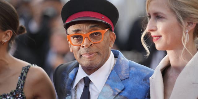 Jury president Spike Lee (middle) posed for photographers upon arrival at the awards ceremony and premiere of the closing film "OSS 117: From Africa with Love" at the 74th International Film Festival in Cannes, southern France, Saturday, July 17, 2021. (AP Photo/Vadim Ghirda)