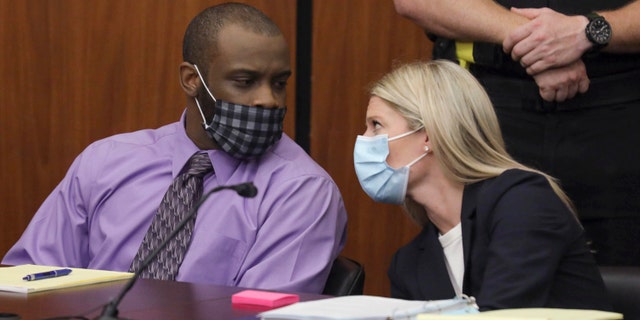Defendant Nathaniel Rowland speaks with his attorney, Alicia Goode, right, during his trial in Richland County Court, Tuesday, July 20, 2021, in Columbia, S.C. Rowland is on trial for the kidnapping and murder of 21-year-old Samantha Josephson. (Tracy Glantz/The State via AP)