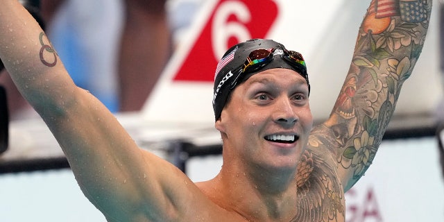 Caeleb Dressel of the United States celebrates winning the men's 100-meter freestyle final at the 2020 Summer Olympics, Thursday, July 29, 2021, in Tokyo, Japan. (AP Photo/Matthias Schrader)