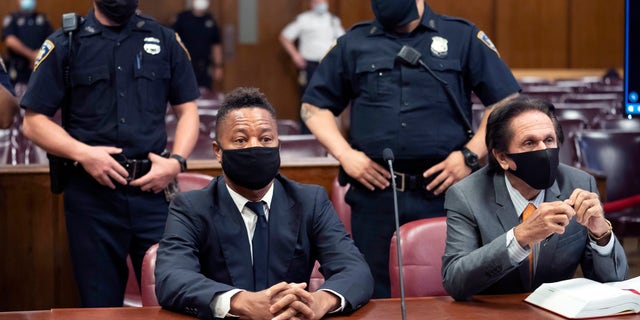 FILE - In this August 13, 2020 file photo, Cuba Gooding Jr., front left, sits at the defense table with his attorney Marc Heller, during a hearing in his sexual misconduct case At New York.  (Steven Hirsch / New York Post via AP, Pool, File)