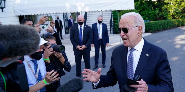 President Joe Biden talks with reporters before boarding Marine One on the South Lawn of the White House in Washington, Friday, July 30, 2021, as he heads Camp David for the weekend. (Associated Press)