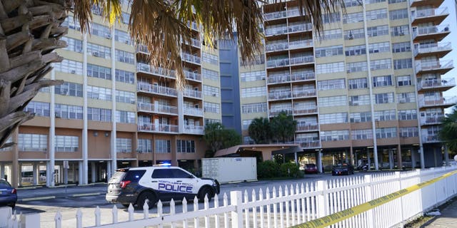 Police patrol outside of Crestview Towers, which was evacuated Friday after an audit prompted by the deadly collapse of Champlain Towers found the building structurally and electrical unsafe, Saturday, July 3, 2021, in North Miami Beach, Fla. (AP Photo/Lynne Sladky)