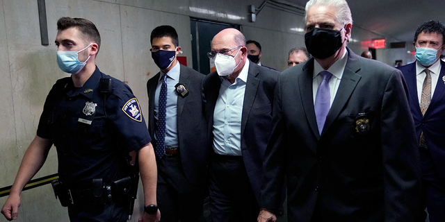 Allen Weisselberg, center, former President Donald Trump's company chief financial officer, arrives to attend the hearing for the criminal case at the criminal court in lower Manhattan in New York on July 1, 2021.