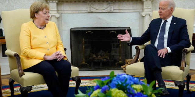 In this July 15, 2021, file photo President Biden meets with German Chancellor Angela Merkel in the Oval Office of the White House in Washington. 