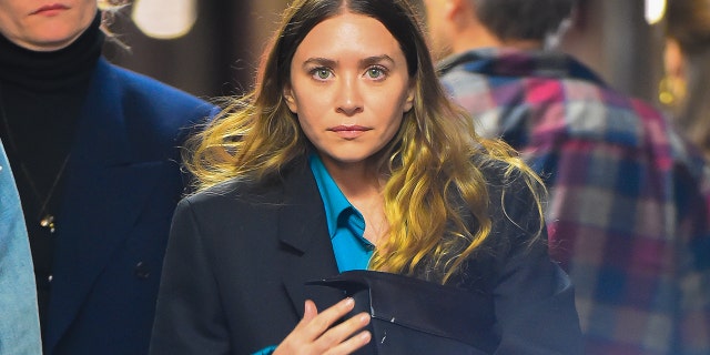 Ashley Olsen was seen walking through the woods with a machete.