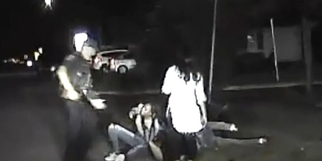 The dashcam video appeared to show two female suspects on top of the officer pinning him to the ground