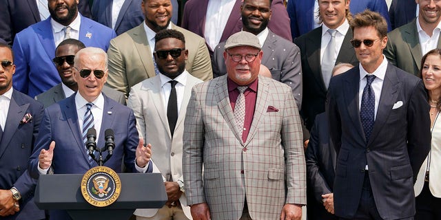 President Biden, surrounded by members of the Tampa Bay Buccaneers, speaks during a ceremony on the South Lawn of the White House in Washington, Tuesday, July 20, 2021, where the president honored the Super Bowl champion Tampa Bay Buccaneers for their Super Bowl LV victory. (AP Photo/Andrew Harnik)