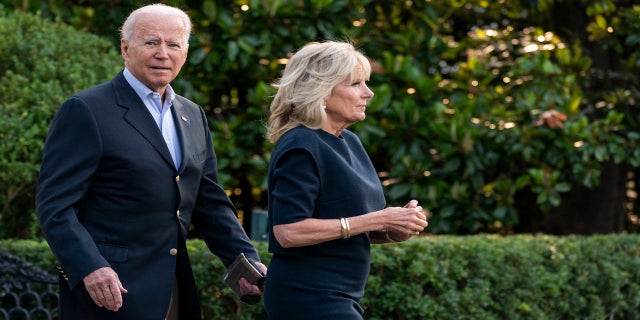 President Joe Biden and first lady Jill Biden walk on the South Lawn at the White House in Washington, Thursday, July 1, 2021, to board Marine One on their way for a brief stop to switch on Air Force One at nearby Andrews Air Force Base, Md., that will take them to Florida. (AP Photo/Manuel Balce Ceneta)