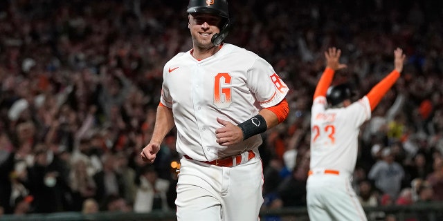 Buster Posey of the San Francisco Giants scored at home against the Los Angeles Dodgers in the eighth inning of a baseball game in San Francisco on Tuesday, July 27, 2021.