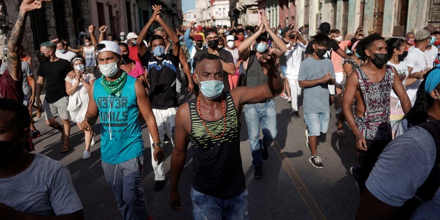 People shout slogans against the government in Havana, Cuba, on July 11, 2021. (Reuters/Alexandre Meneghini)