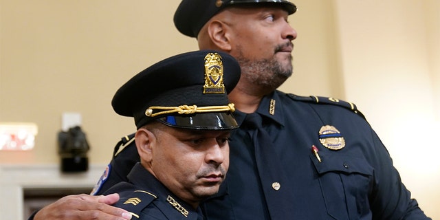 U.S. Capitol Police Sgt. Aquilino Gonell left, and U.S. Capitol Police Sgt. Harry Dunn stand after the House select committee hearing on the Jan. 6 attack on Capitol Hill in Washington, Tuesday, July 27, 2021. 