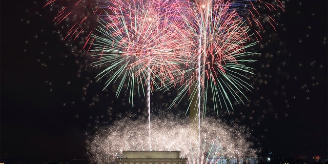Fireworks explode over Lincoln Memorial, Washington Monument and U.S. Capitol, at the National Mall, during the Independence Day celebrations, in Washington, on Sunday, July 4, 2021. (AP Photo/Jose Luis Magana)