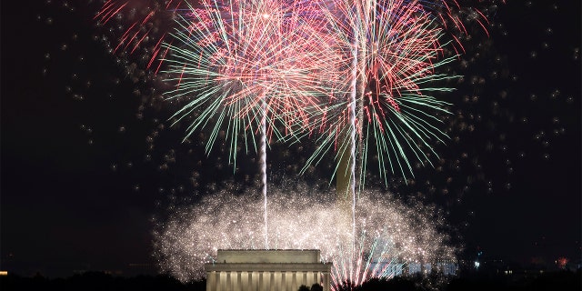 Fireworks will explode on the Lincoln Memorial, the Washington Monument, and the US Capitol at the National Mall during the Independence Day celebration in Washington on Sunday, July 4, 2021.  (AP Photo / Jose Luis Magana)