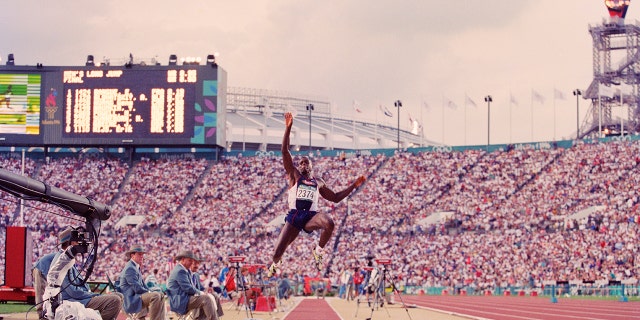 Carl Lewis of the United States competing in the men's long jump on July 29, 1996, at the XXVI Summer Olympic Games at the Alexander Memorial Coliseum in Atlanta, Ga. (Mike Powell/Allsport/Getty Images)