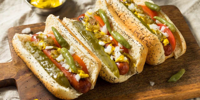 Americans' second favorite regional style of hot dog is Chicago style. Chicago hot dogs are all-beef franks topped with yellow mustard, dark green relish, chopped raw onion, a pickle spear, sport peppers, tomato slices and celery salt, served in a poppy seed bun.