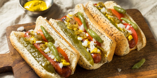 Americans' second favorite regional style of hot dog is Chicago style. Chicago hot dogs are all-beef franks topped with yellow mustard, dark green relish, chopped raw onion, a pickle spear, sport peppers, tomato slices and celery salt, served in a poppy seed bun.
