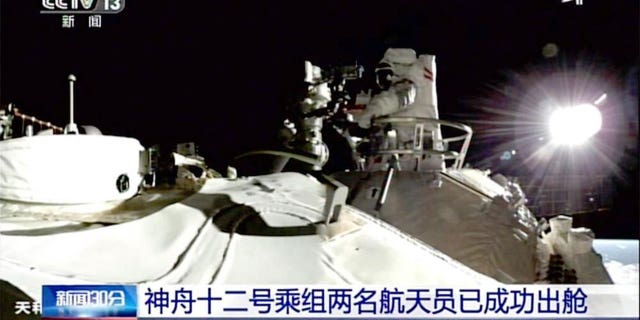 Two astronauts on Sunday made the first spacewalk outside China’s new orbital station to set up cameras and other equipment using a 15-meter-long (50-foot-long) robotic arm. (AP)