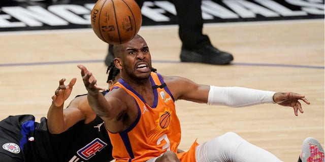 Phoenix Suns guard Chris Paul, right, goes after a loose ball along with Los Angeles Clippers guard Terance Mann during the second half in Game 6 of the NBA basketball Western Conference Finals Wednesday, June 30, 2021, in Los Angeles. (AP Photo/Mark J. Terrill)