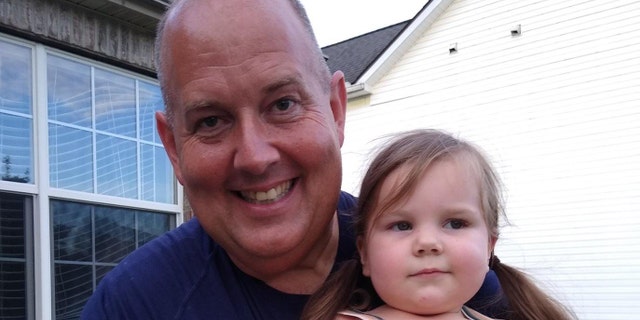 Police officer Brian Wilson with the Columbus, 俄亥俄, police department recently saved Carmella Lopez, 2, after she almost drowned.