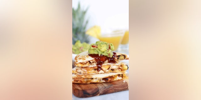 Tieghan Gerard, the creator of Half-Baked Harvest shared her "Hawaiian BBQ Quesadillas with Pineapple-Mango Guacamole" recipe with Fox News for National Avocado Day. 