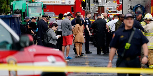Emergency crews respond after a building under construction collapsed Thursday, July 1, 2021, in Washington. (AP Photo/Carolyn Kaster)
