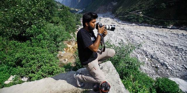 Reuters photographer Danish Siddiqui covers monsoon floods and landslides in upper Govindghat, India on Saturday June 22, 2013 (AP)