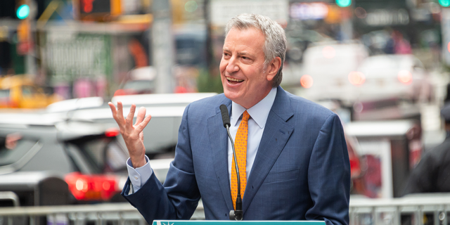 New York City Mayor Bill de Blasio attends the opening of a Broadway workers' vaccination center in Times Square on April 12, 2021 in New York City.  De Blasio and his top health officials on Wednesday were reluctant to reinstate a mask mandate without data from the CDC to support the new guidelines. 