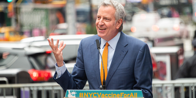 Mayor of New York City Bill de Blasio attends the opening of a vaccination center for Broadway workers in Times Square on April 12, 2021 in New York City. De Blasio and his top health officials Wednesday were reluctant to re-implement a mask mandate without data from the CDC to support its new guidelines. 