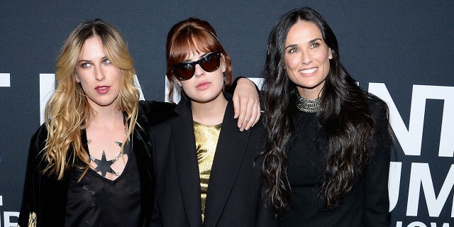 Demi Moore poses with two of her daughters.