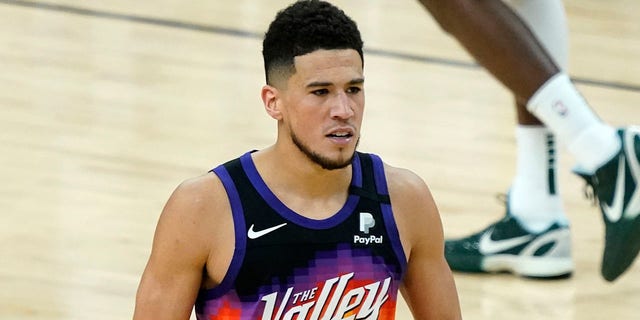 Phoenix Suns guard Devin Booker after a basket against the Milwaukee Bucks during the second half of Game 1 of the NBA Finals on July 6, 2021, in Phoenix.