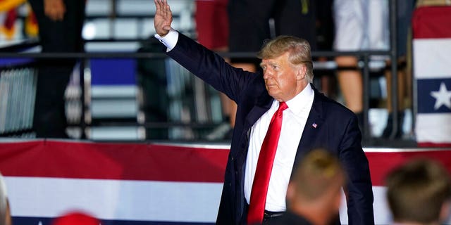 Former President Donald Trump waves to supporters as he leaves the stage after speaking at a rally at the Lorain County Fairgrounds, Saturday, June 26, 2021, in Wellington, Ohio. (AP Photo/Tony Dejak)