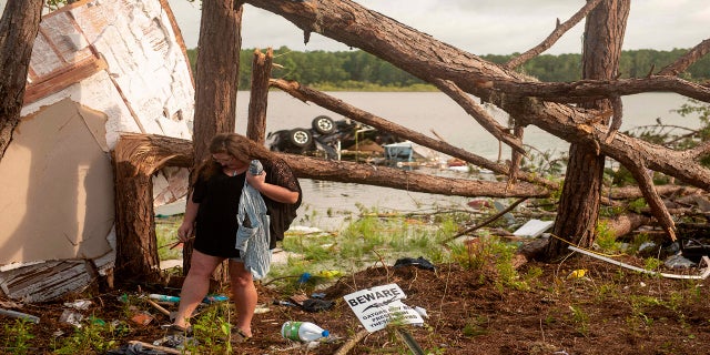 Missouri Lattanzi, a resident of RV, is searching for items destroyed by a tornado in Kings Bay at a submarine base on Wednesday, following heavy rains caused by tropical storm Elsa in Kings Bay, Ga. On Thursday. -weather caused tornado warnings in Delaware and New Jersey. in early Friday when the system was moving in the middle of the Atlantic Ocean and in the northeastern United States. (Public Relations Class 3 via Aaron Xavier Saldana / AP U.S. Navy)