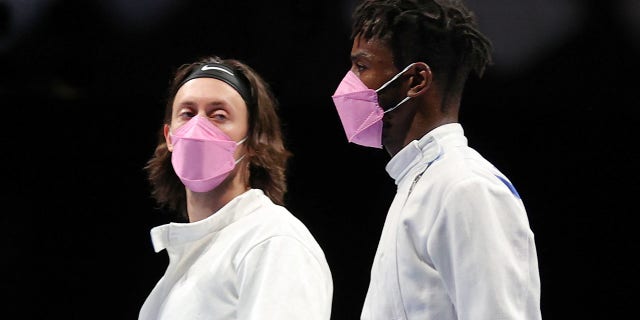 Jacob Hoyle of Team United States, left, and Curtis McDowald of Team United States react to their loss to Team Japan in Men's Épée Team Table of 16 on day seven of the Tokyo 2020 Olympic Games at Makuhari Messe Hall on July 30, 2021 in Chiba, Japan. (Photo by Elsa/Getty Images)