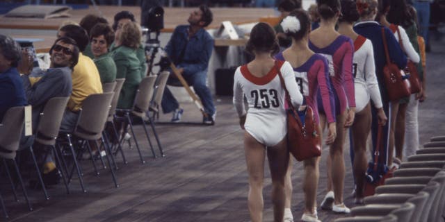 Athletes competing in the women's gymnastic event at the Munich 1972 Summer Olympics wore colorful leotards with long sleeves.