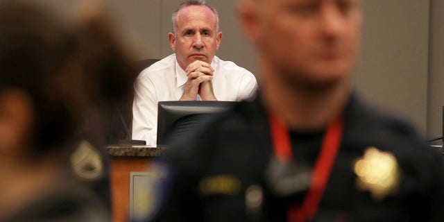 Sacramento Mayor Darrell Steinberg looks on as activists disrupt a Sacramento City Council meeting on March 5, 2019 in Sacramento, Calif.