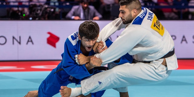 Behruzi Khojazoda of Tajikistan (blue judogi), 24, throws Tohar Butbul of Israel for an ippon during the 2019 Tokyo World Judo Championships at the Nippon Budokan on August 27, 2019 in Tokyo, Japan. (Photo by David Finch/Getty Images)