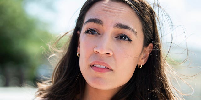 Rep. Alexandria Ocasio-Cortez, D-N.Y., talks with reporters before a House vote on creating a select committee to investigate the January 6th attack on the Capitol, June 30, 2021.