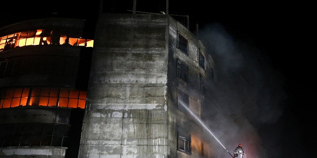 DHAKA, BANGLADESH - 2021/07/09: Firefighters work to extinguish fire at a factory called Hashem Foods Ltd. in Rupganj, Narayanganj district on the outskirts of Dhaka. (Photo by Md. Mir Hossen Roney/Pacific Press/LightRocket via Getty Images)