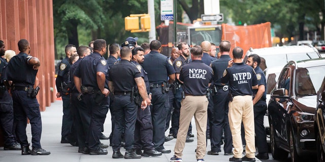 New York Police Department (NYPD) officers stand guard outside of Washington Square Park amid a rise of gun violence in New York, on Saturday, July 17, 2021. (Michael Nagle/Bloomberg via Getty Images)