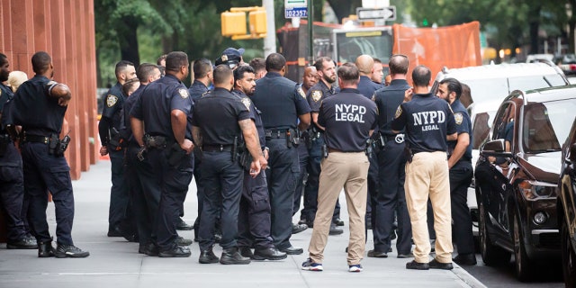 New York Police Department (NYPD) officers stand guard outside of Washington Square Park amid a rise of gun violence in New York, U.S., on Saturday, July 17, 2021. Photographer: Michael Nagle/Bloomberg via Getty Images