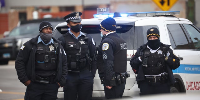 Police secure the crime scene following a shooting at a tow company garage.  (Photo by Scott Olson/Getty Images)