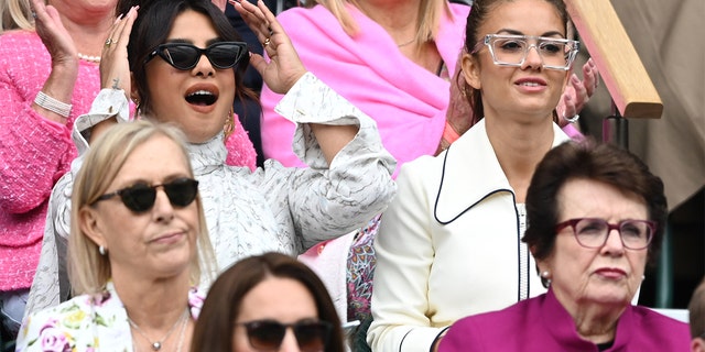 Priyanka Chopra attends Day 12 of the Wimbledon Tennis Championships at All England Lawn Tennis and Croquet Club on July 10, 2021 in London, England.  Sitting below with sunglasses is Kate Middleton.