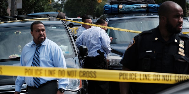 JULY 14: Police converge on the scene of a shooting in Brooklyn, one of numerous during the day, on July 14, 2021 in New York City. (Photo by Spencer Platt/Getty Images) 